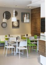 Riva Chairs in White & Lime with HPL Tables in an Indoor Cafe Setting