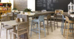 NARDI Faro Tall Bar Stools in indoor café at wooden bench with Costa Bistro Chairs
