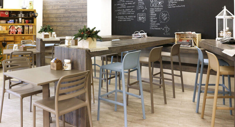 NARDI Faro Tall Bar Stools in indoor café at wooden bench with Costa Bistro Chairs