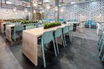 NARDI Bit Chairs in Spearmint at wooden tables indoor cafeteria environment