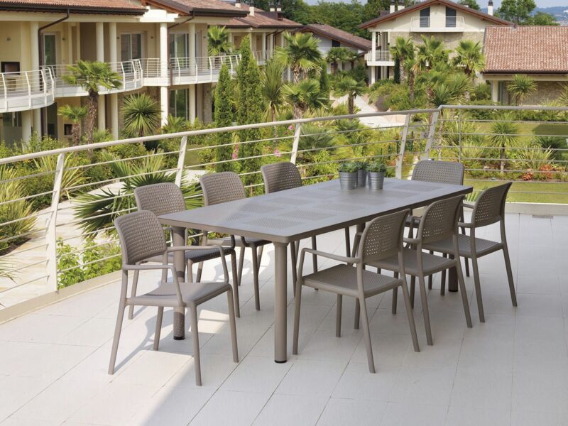 Levante 7 Piece Dining Set NZ - Extended to accommodate 8 chairs in Taupe on a deck
