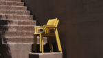 Trill Armchairs in Mustard - Pictured Stacked on Outdoor Staircase
