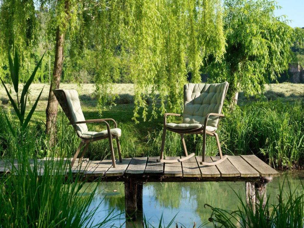 Nardi folio cushioned rocking chair and fixed version in garden