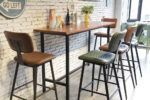 ByDezign Aviator Mid-Century Modern Tall Bar Stools at Bar Leaner