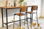 ByDezign Retro School Tall Bar Stools in Tan at Bar leaner