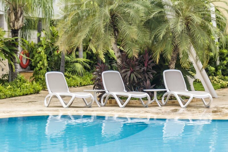 NARDI Omega Sun Loungers (White & Taupe) with Spritz Tables (White) in Pool Side Garden