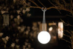 Fatboy® Bolleke Spherical Lamp in Light Grey Hanging from Tree