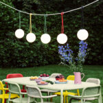 Fatboy® Bolleke Spherical Lamps Hanging over Outdoor Dining Set