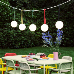 Fatboy® Bolleke Spherical Lamps Hanging over Outdoor Dining Set