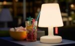 Fatboy® Edison the Petit Lamp on Outdoor Side Table at Night