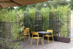 NARDI Sipario Eco Wall Planters in Outdoor Cafe Area with Trill Bistro Chairs